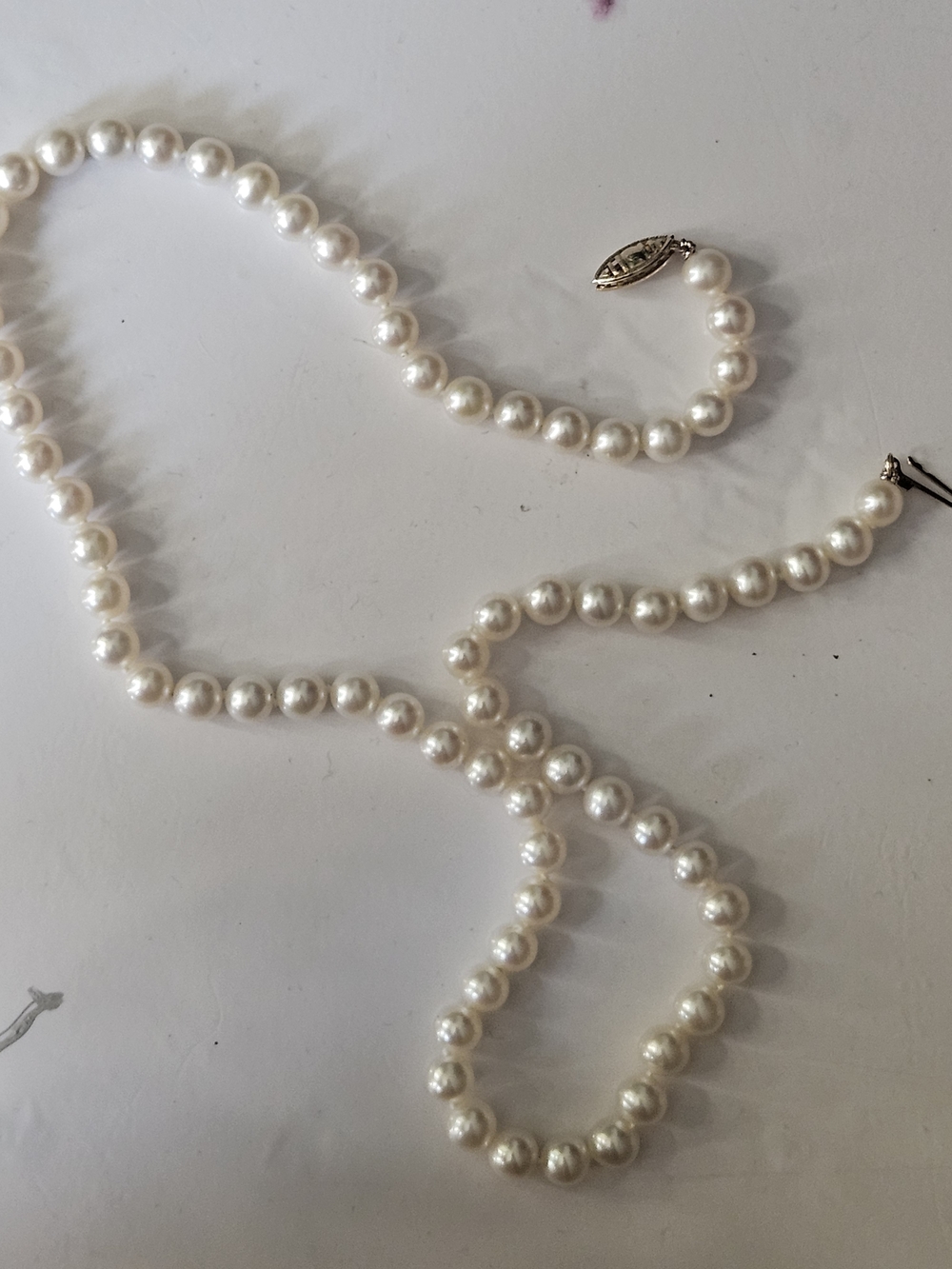 Lustrous White Pearl Strand Necklace with Decorative Clasp